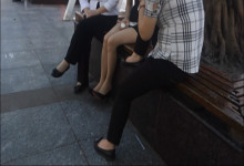 Black dress, white shirt and shoe play